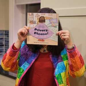 person holding Privacy,
       Please! book